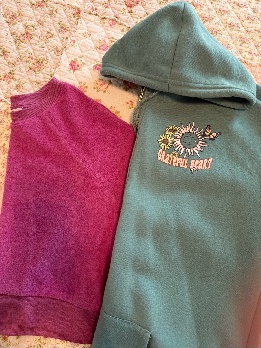 Two sweatshirts. Green 'Grateful Heart' Hooded Sweatshirt and a Purple one.